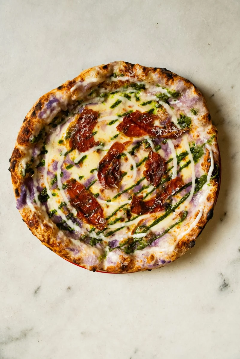 Neapolitan pizza with a golden, blistered crust.